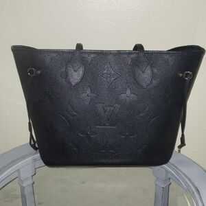 Authentic Louis Vuitton Neverfull MM tote in embossed Monogram Empreinte leather